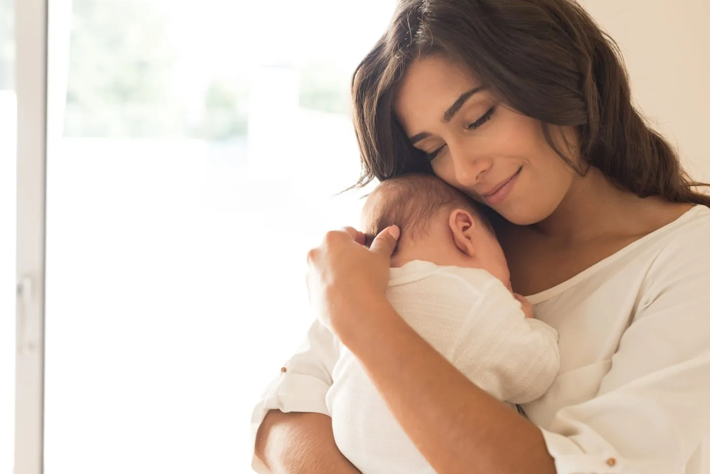 A mother holding her baby